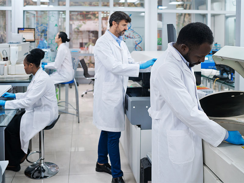 Male and female researchers working in a life sciences laboratory