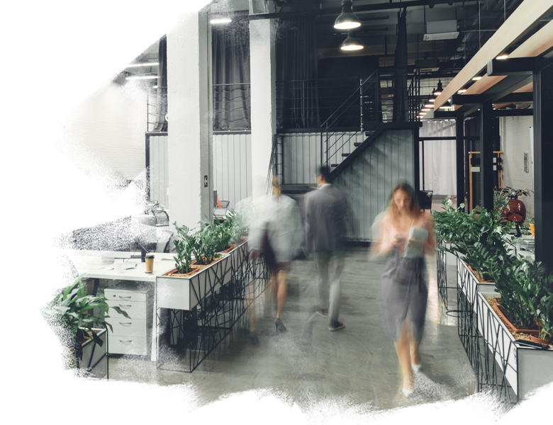 Employees walking inside a modern office space